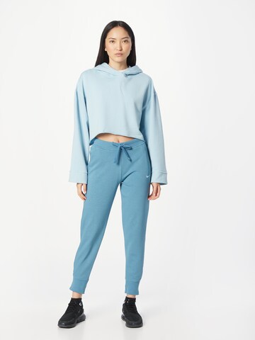 Effilé Pantalon de sport NIKE en bleu