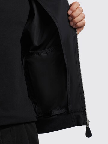 khujo Prehodna jakna 'Lasse' | črna barva