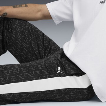 PUMA Loosefit Sportbroek 'T7' in Zwart