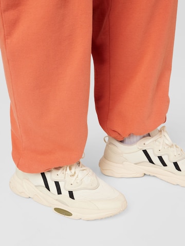 ABOUT YOU Limited Trousers 'Luis' by Jannik Stutzenberger' in Orange