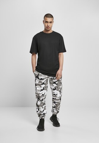 Tapered Pantaloni di Urban Classics in bianco