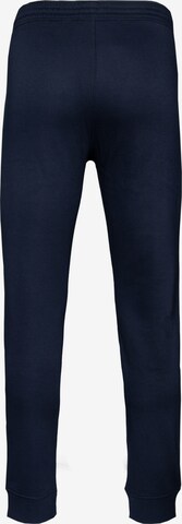 Champion Authentic Athletic Apparel Tapered Broek in Blauw