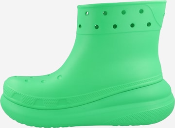 Crocs أحذية من المطاط بلون أخضر