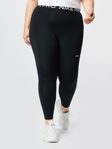 Skinny Pantalon de sport NIKE en noir : devant