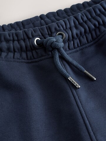 Next - Tapered Calças em azul