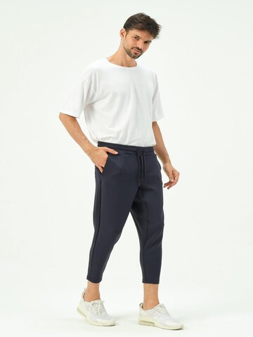 C&City Tapered Trousers in Blue: front