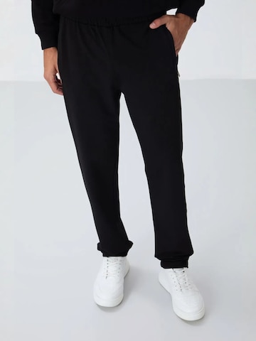regular Pantaloni di Tommy Life in nero: frontale