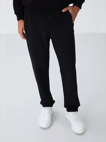 Tommy Life Sports trousers 'Jogginghose' in Black: front
