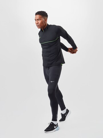 Skinny Pantaloni sportivi 'Phenom' di NIKE in nero