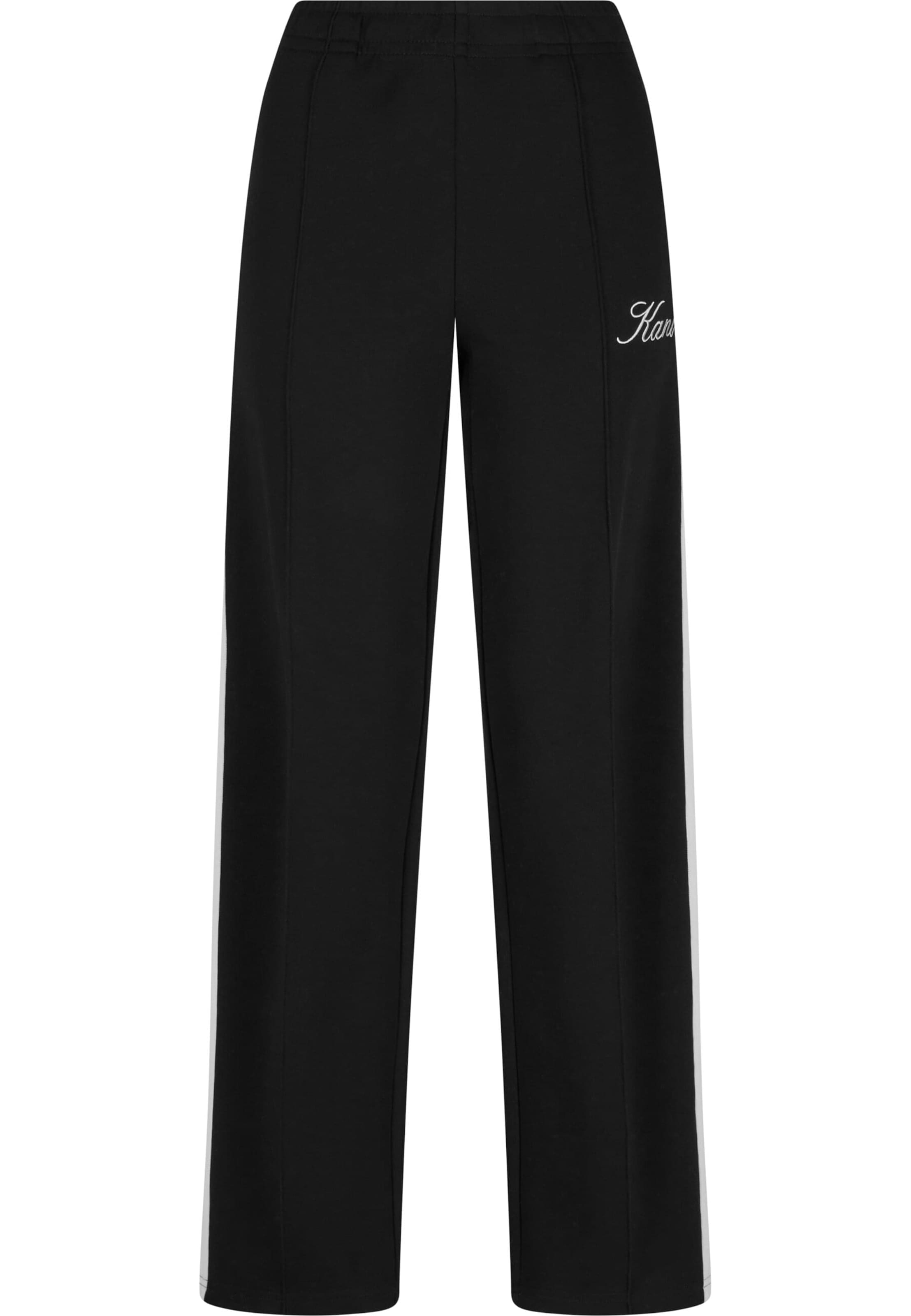 Karl Kani Loose fit Trousers with creases in Black: front