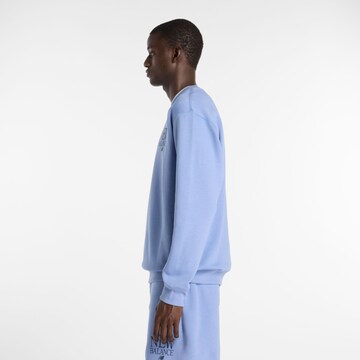 T-Shirt 'Reimagined Fleece Crew' new balance en bleu