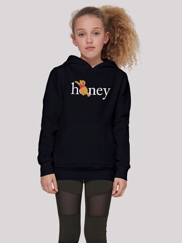 F4NT4STIC Sweatshirt 'Disney Winnie The Pooh Honey' in Zwart: voorkant