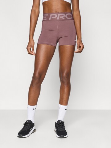 NIKE Skinny Παντελόνι φόρμας σε λιλά: μπροστά