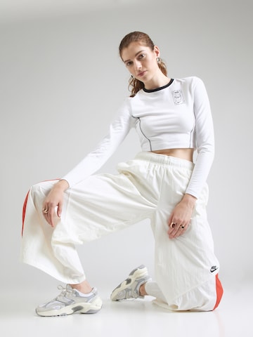 Nike Sportswear Široký strih Nohavice - Béžová