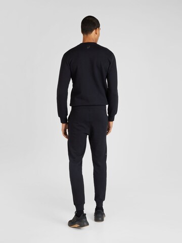 ASICS Tapered Sports trousers in Black