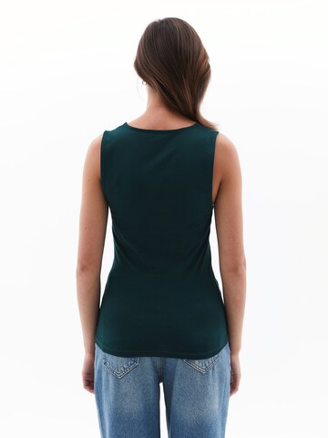 Haut OXXO en vert