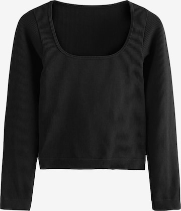 Tricou de la Next pe negru: față