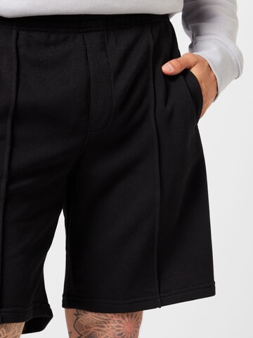 WEEKDAY Normalny krój Spodnie 'Terry' w kolorze czarny