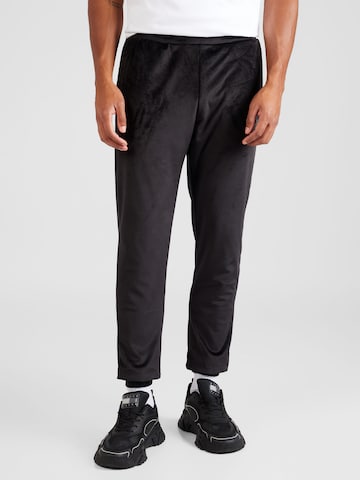 Gianni Kavanagh Tapered Trousers in Black: front