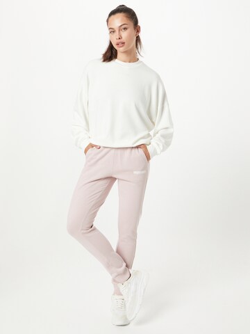 Tapered Pantaloni sport 'Legacy' de la Hummel pe roz