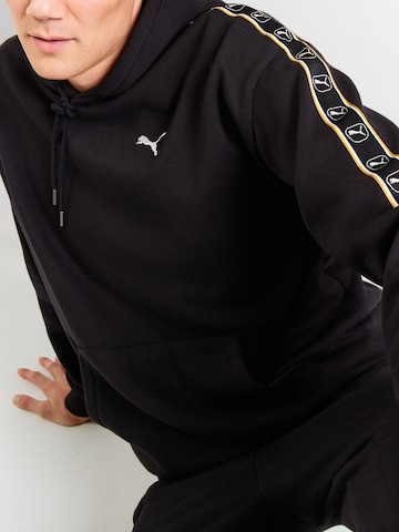 PUMASweater majica 'Ess Elevated Tape' - crna boja