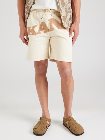 Karl Kani Regular Pants in Beige: front