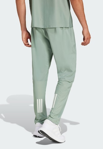 ADIDAS PERFORMANCE Tapered Sports trousers 'Own The Run' in Green