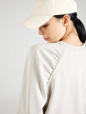 Athlecia Sports sweatshirt in Beige