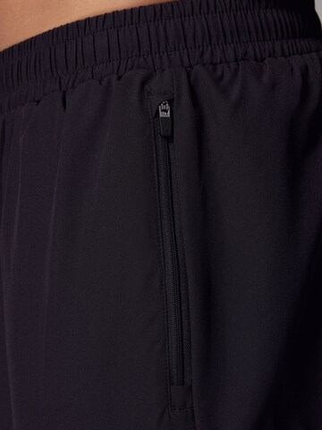 Next - Tapered Pantalón deportivo en negro