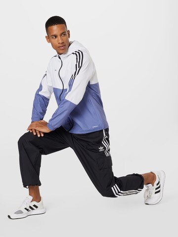 ADIDAS PERFORMANCE Sportovní bunda 'Tiro' – modrá