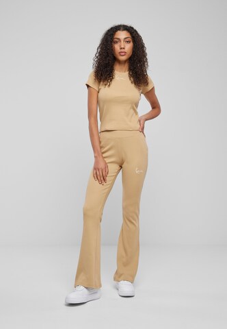 Karl Kani Regular Sports trousers in Beige