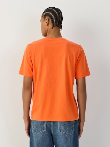 T-Shirt Next en orange