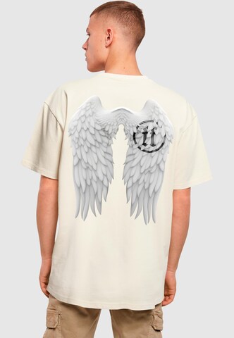 Forgotten Faces T-Shirt 'Wings' in Beige: predná strana