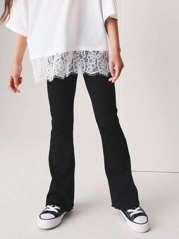 Next - Acampanado Leggings en negro: frente