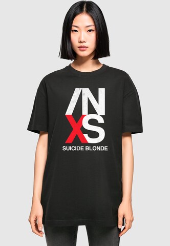 Merchcode Oversized shirt 'INXS - X Tour' in Zwart: voorkant