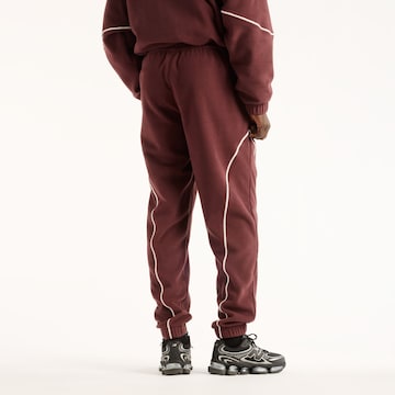 new balance - Perna larga Calças 'Trackside Polar Fleece Jogger' em vermelho