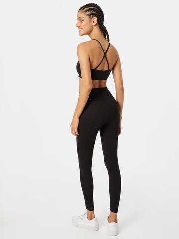 PUMA Skinny Sportbroek in Zwart