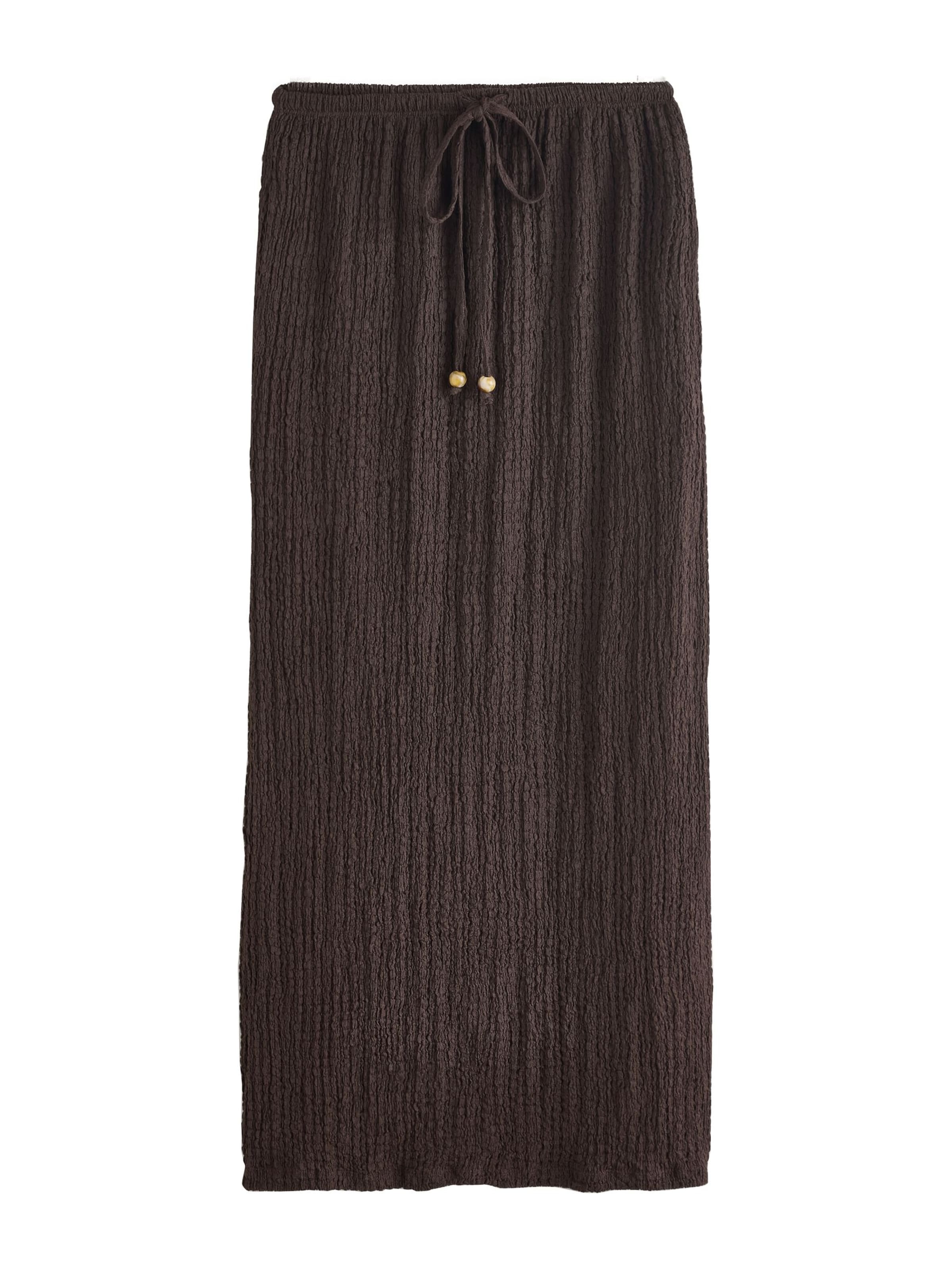 Next Kjol i choklad, Produktvy