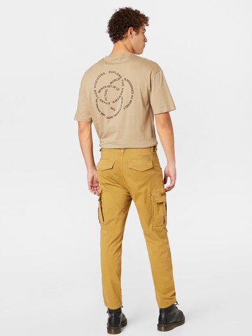 Regular Pantalon cargo ALPHA INDUSTRIES en jaune