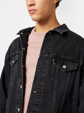 LEVI'S ® Overgangsjakke 'Xmonsters Trucker' i svart