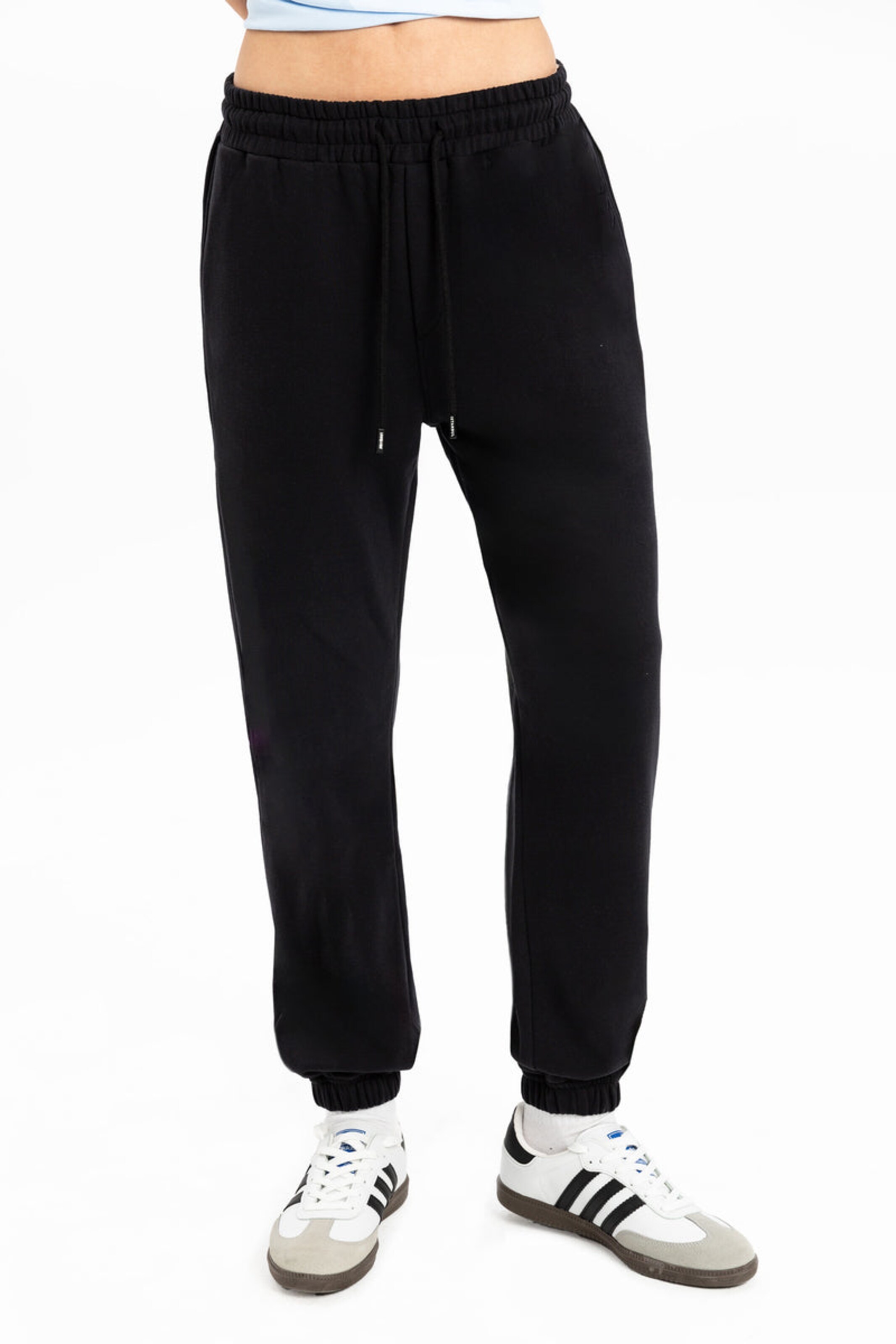 UNIQVIBE Tapered Trousers in Black: front