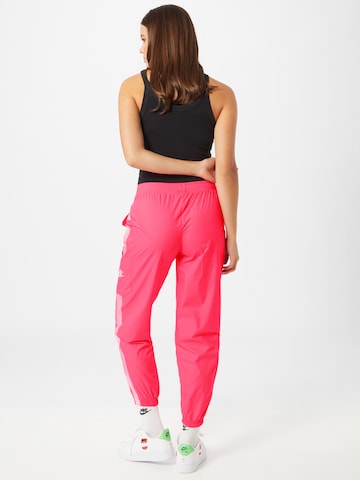 Nike Sportswear Tapered Hose in Pink