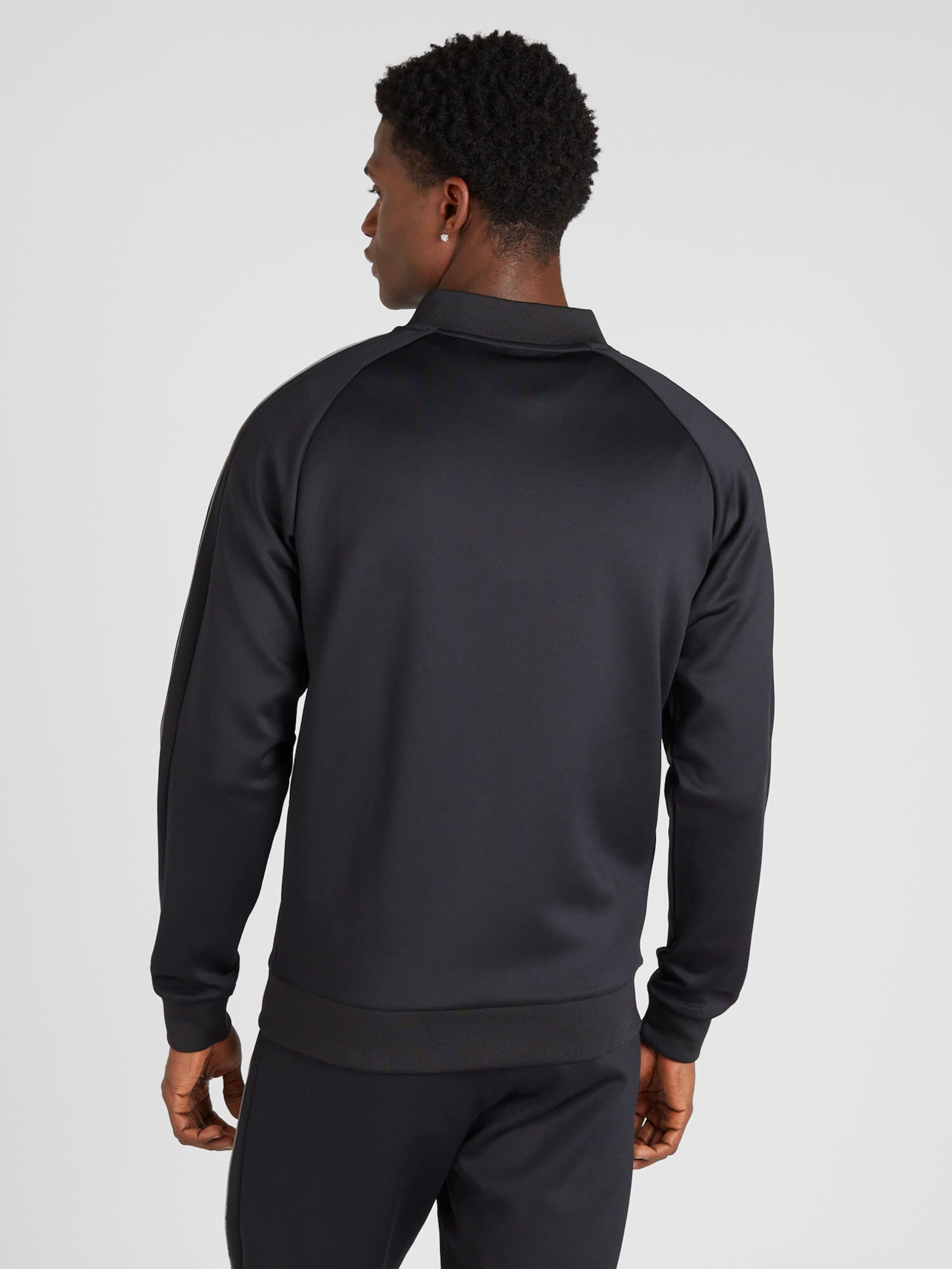 ELLESSE Tracksuit Bunero in Black ABOUT YOU