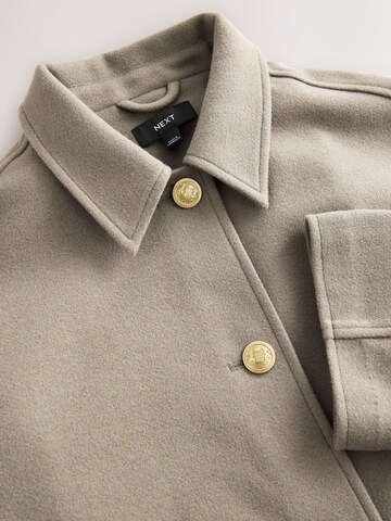 Next Välikausitakki värissä beige