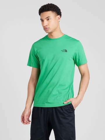 THE NORTH FACE - Camiseta en verde: frente