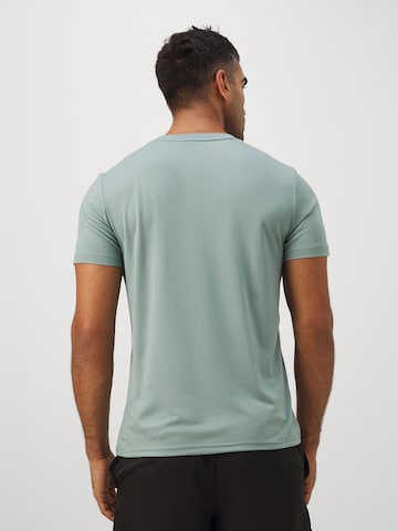 PUMA Koszulka funkcyjna 'Tad Essentials' w kolorze zielony