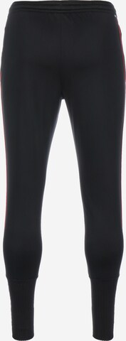 Effilé Pantalon de sport NIKE en noir