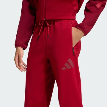 ADIDAS SPORTSWEAR - Tapered Pantalón deportivo 'Z.N.E.' en rojo