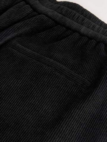 Wide leg Pantaloni de la Next pe negru