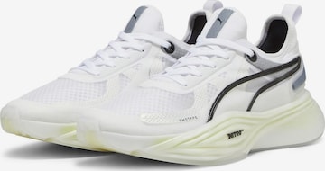 Chaussure de course 'Nitro Squared' PUMA en blanc